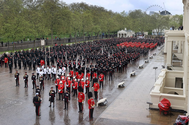 Image of military personnel, seen here at Wellington Barracks in London, before taking part in the King's Coronation.

The UK Armed Forces conduct their largest ceremonial operation for 70 years today (06/05/2023), and accompanied Their Majesties King Charles III and Queen Consort Camilla to the Coronation service at Westminster Abbey.

More than 7,000 soldiers, sailors and aviators from across the UK and Commonwealth participated in ceremonial activities across processions, fly pasts and gun salutes marking the historic event.

With around 200 personnel providing a Guard of Honour at Buckingham Palace, together this made up the largest UK military ceremonial operation for 70 years.

As well as marching detachments from across the Household Division, Royal Navy, British Army and Royal Air Force, more than 400 troops from the Commonwealth nations and British Overseas Territories were on parade, representing the diversity and traditions of Armed Forces around the globe with connections to His Majesty The King.

Foot Guards of the Household Division lined The Mall, the Royal Navy lined their spiritual home at Admiralty Arch, the Royal Marines at Trafalgar Square and the Royal Air Force Whitehall and Parliament Square.


