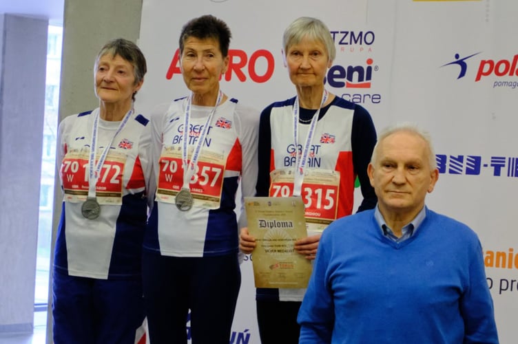 Farnham Runners member Jane Georghiou (second right) won a silver team medal in Torun, Poland