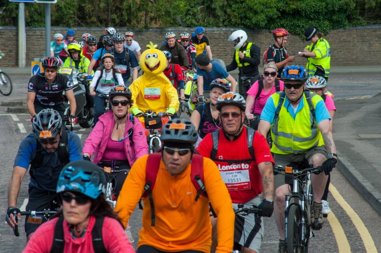 A group of cyclists taking part in the London to Brighton cycle ride through Surrey