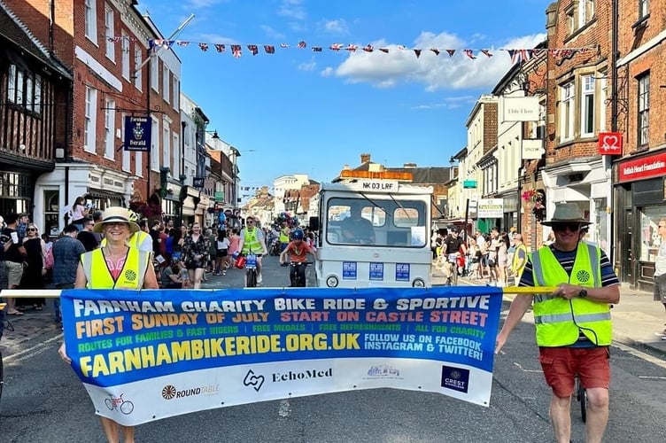 Farnham Round Table promote the bike ride in the Farnham Carnival parade last Saturday