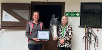 Treloar's presents certificate to Broadlands Riding for the Disabled