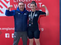 Rising weightlifting star wins silver thanks to community support