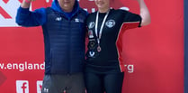 Rising weightlifting star wins silver thanks to community support