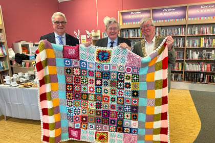 Library donates community handcrafted blankets to charity auction