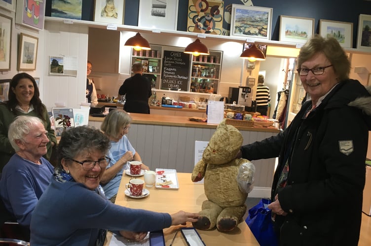 Kate Thomas bringing her 60-year-old teddy bear Rupert for repairs by Veronica Correa.